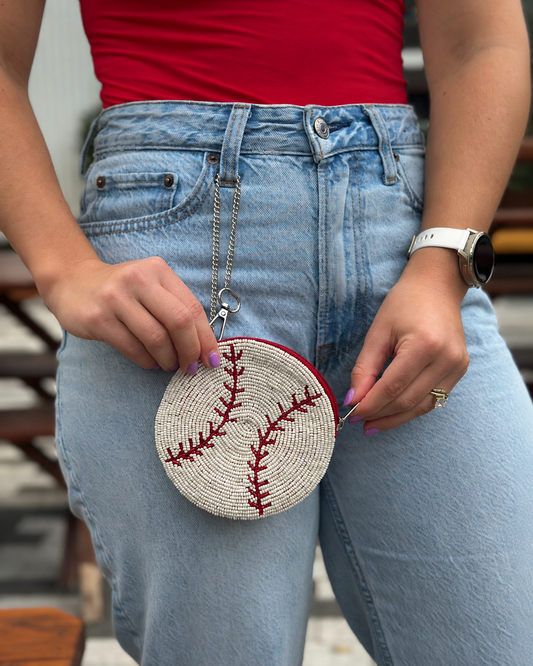 Round white and red baseball beaded coin purse styled with red shirt and jeans