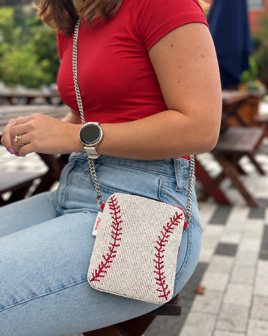 White and red baseball stitch beaded cell phone crossbody styled with red t-shirt
