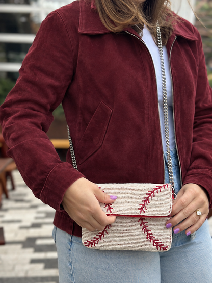 White and red baseball stitch beaded clutch front view