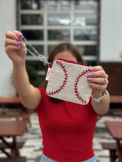 White and red baseball stitch beaded coin purse held up by chain