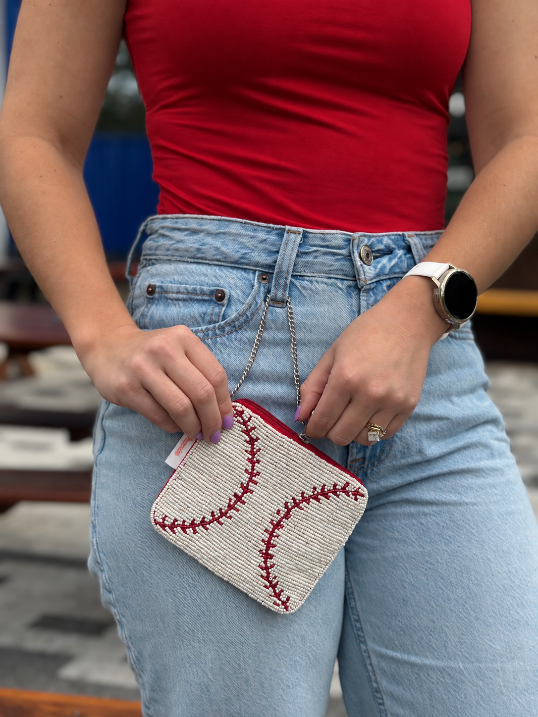 White and red baseball stitch beaded coin purse styled at waist