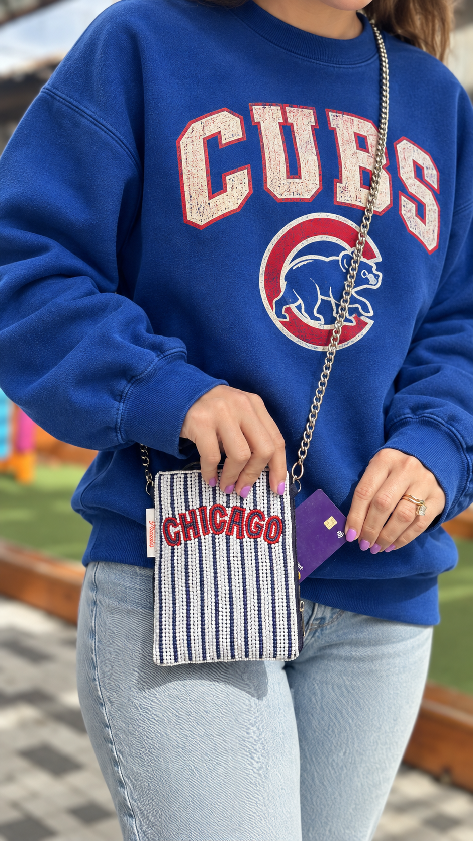 CHICAGO striped beaded cell phone crossbody styled with blue Cubs sweatshirt