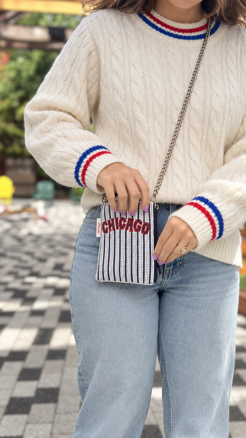 CHICAGO striped beaded cell phone crossbody styled with cream sweater
