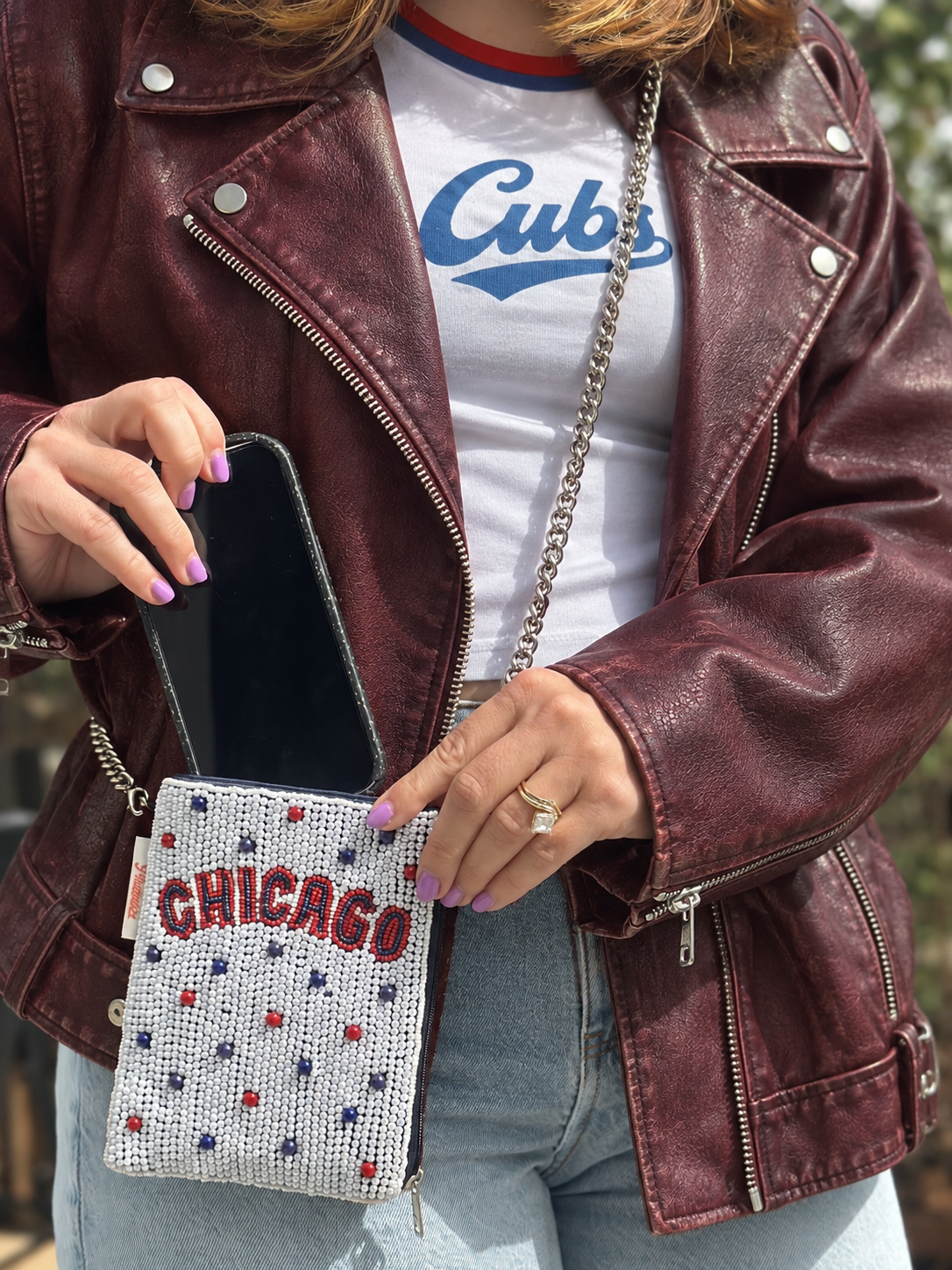 CHICAGO white red and blue beaded cell phone crossbody styled with burgundy leather jacket
