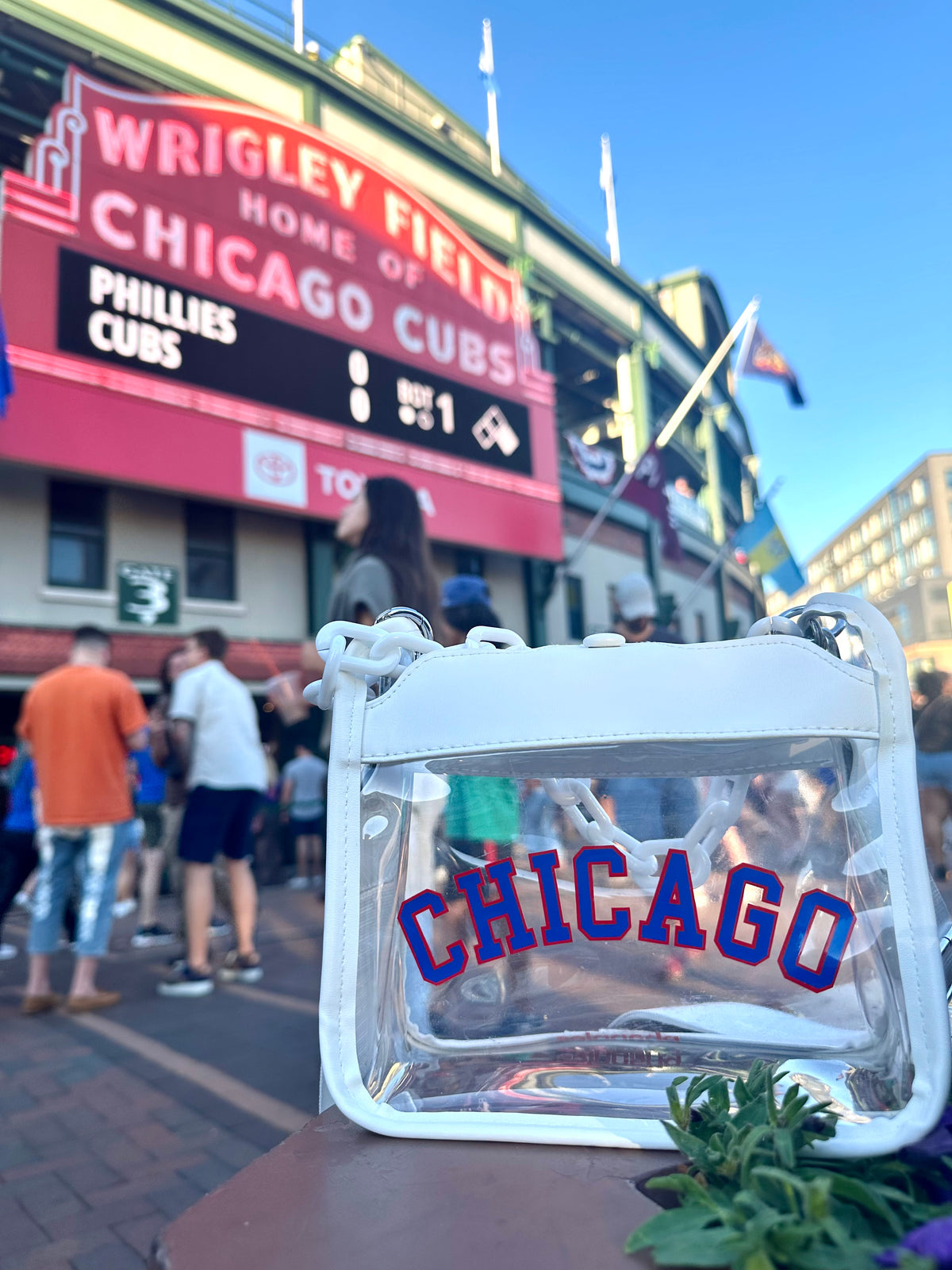 Close-up of Chicago white clear crossbody bag with red and blue CHICAGO lettering