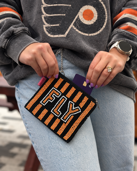 FLY orange black and white beaded coin purse styled with hockey sweatshirt