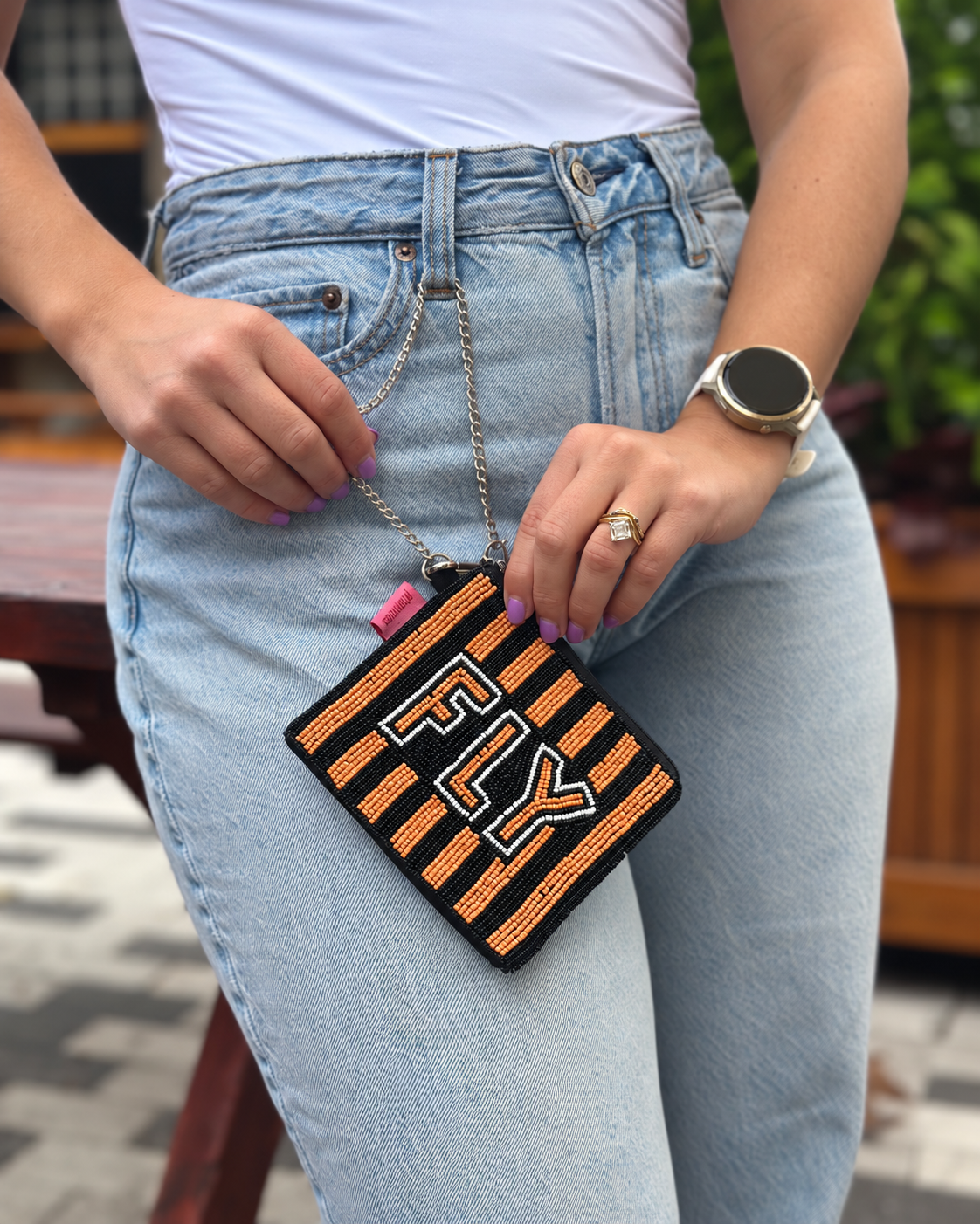 FLY orange black and white beaded coin purse held by chain