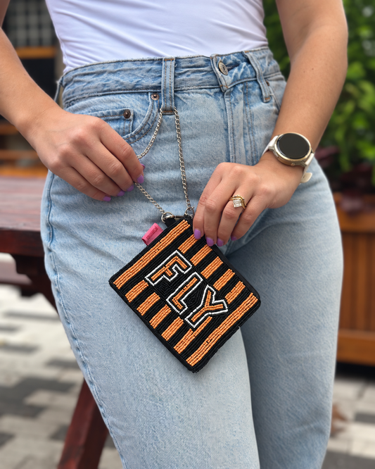 FLY orange black and white beaded coin purse held by chain