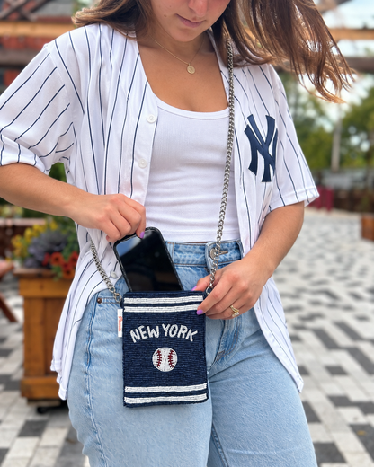 NEW YORK navy baseball beaded cell phone crossbody styled with an oversized white pinstripe baseball jersey