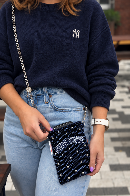 NEW YORK navy beaded cell phone crossbody styled with navy sweater