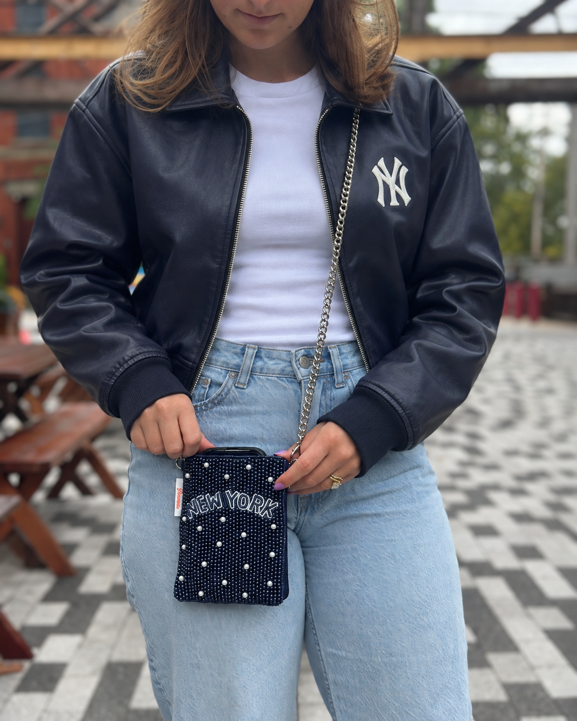NEW YORK beaded cell phone crossbody styled with a navy leather jacket and white tee