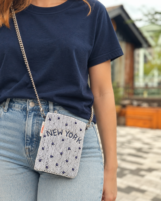 NEW YORK white and navy dot beaded cell phone crossbody styled with navy t-shirt