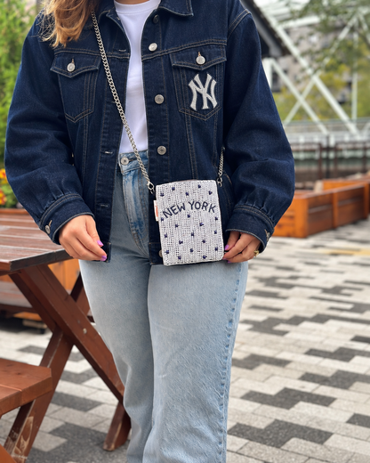 NEW YORK white and navy dot beaded cell phone crossbody styled with dark denim jacket
