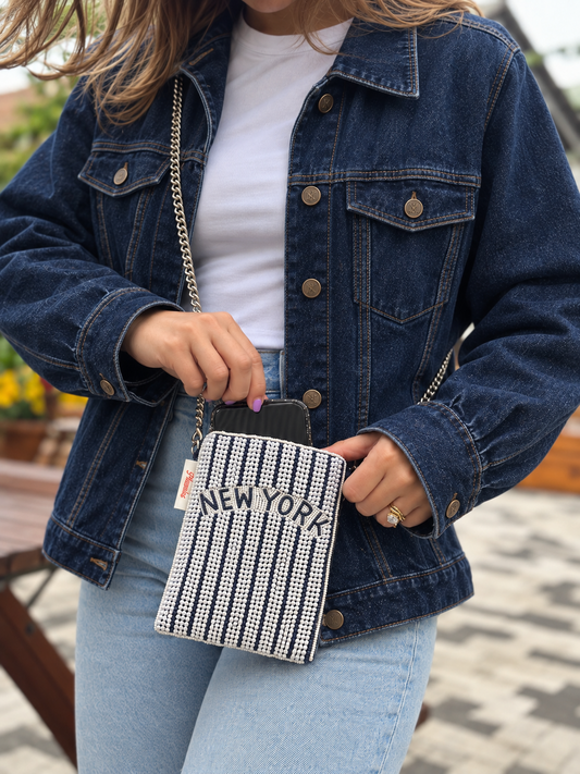 NEW YORK navy and white pinstripe beaded cell phone crossbody styled with dark denim jacket