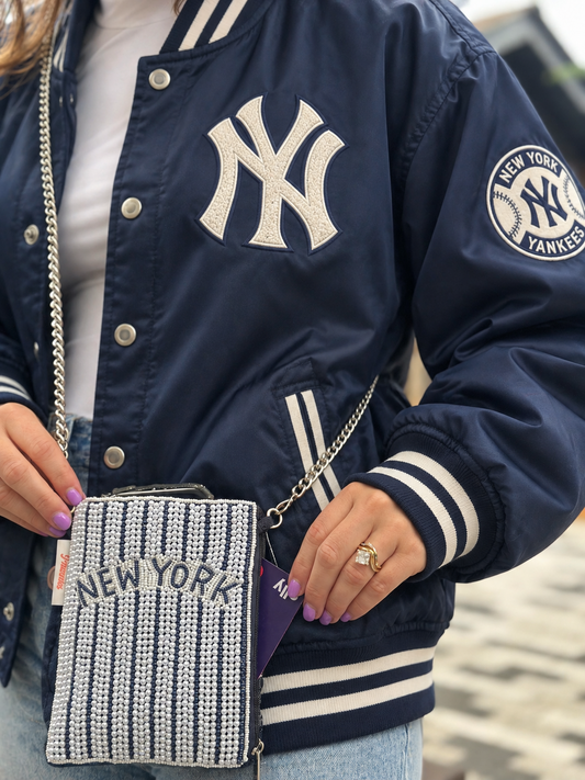 NEW YORK navy and white pinstripe beaded cell phone crossbody styled with navy varsity jacket