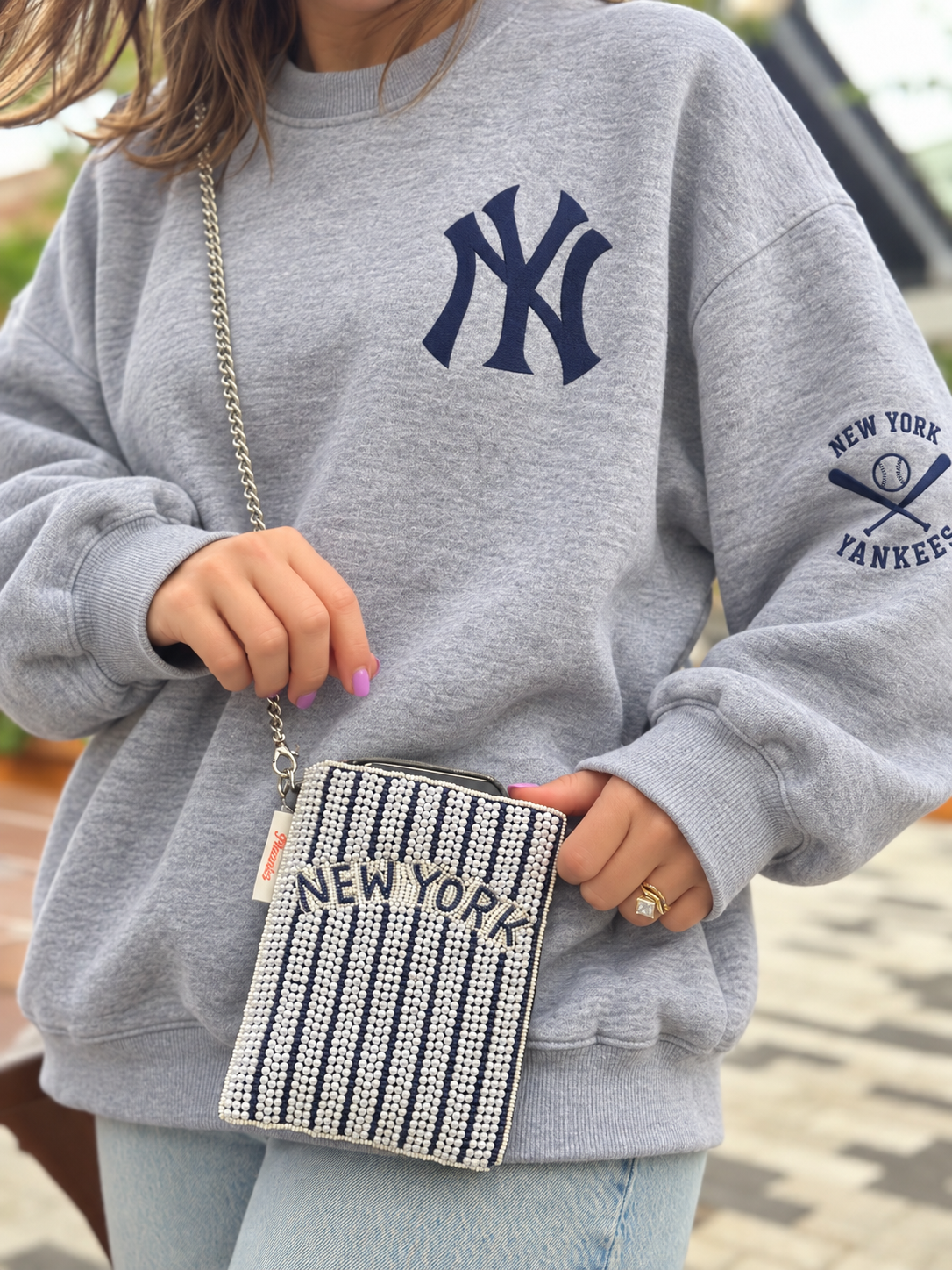 NEW YORK navy and white pinstripe beaded cell phone crossbody styled with oversized gray crewneck