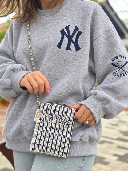 NEW YORK navy and white pinstripe beaded cell phone crossbody styled with oversized gray crewneck