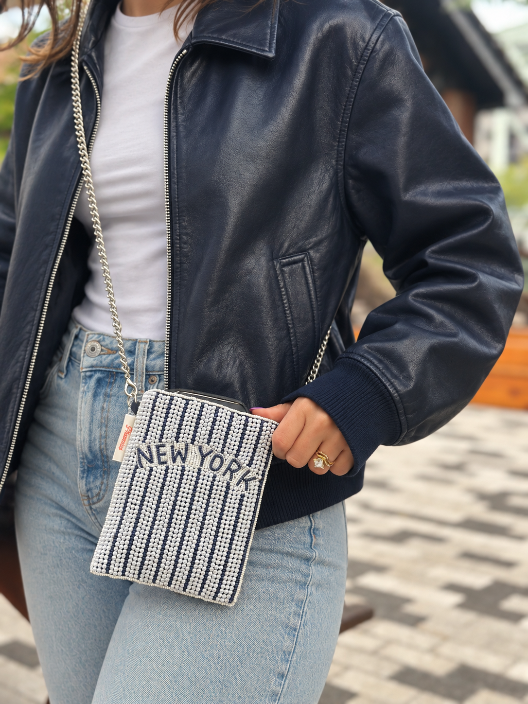 NEW YORK navy and white pinstripe beaded cell phone crossbody styled with navy leather jacket