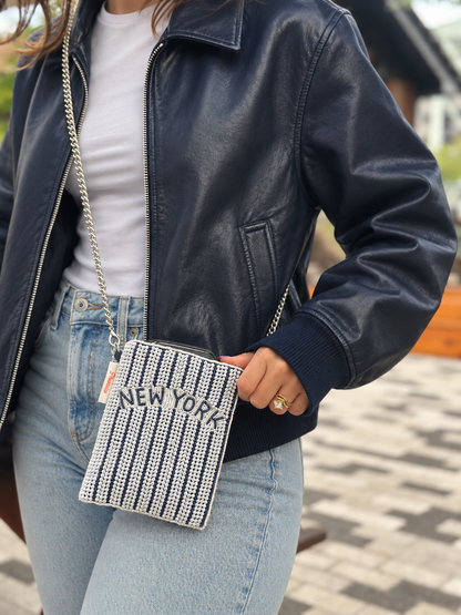 NEW YORK navy and white pinstripe beaded cell phone crossbody styled with navy leather jacket