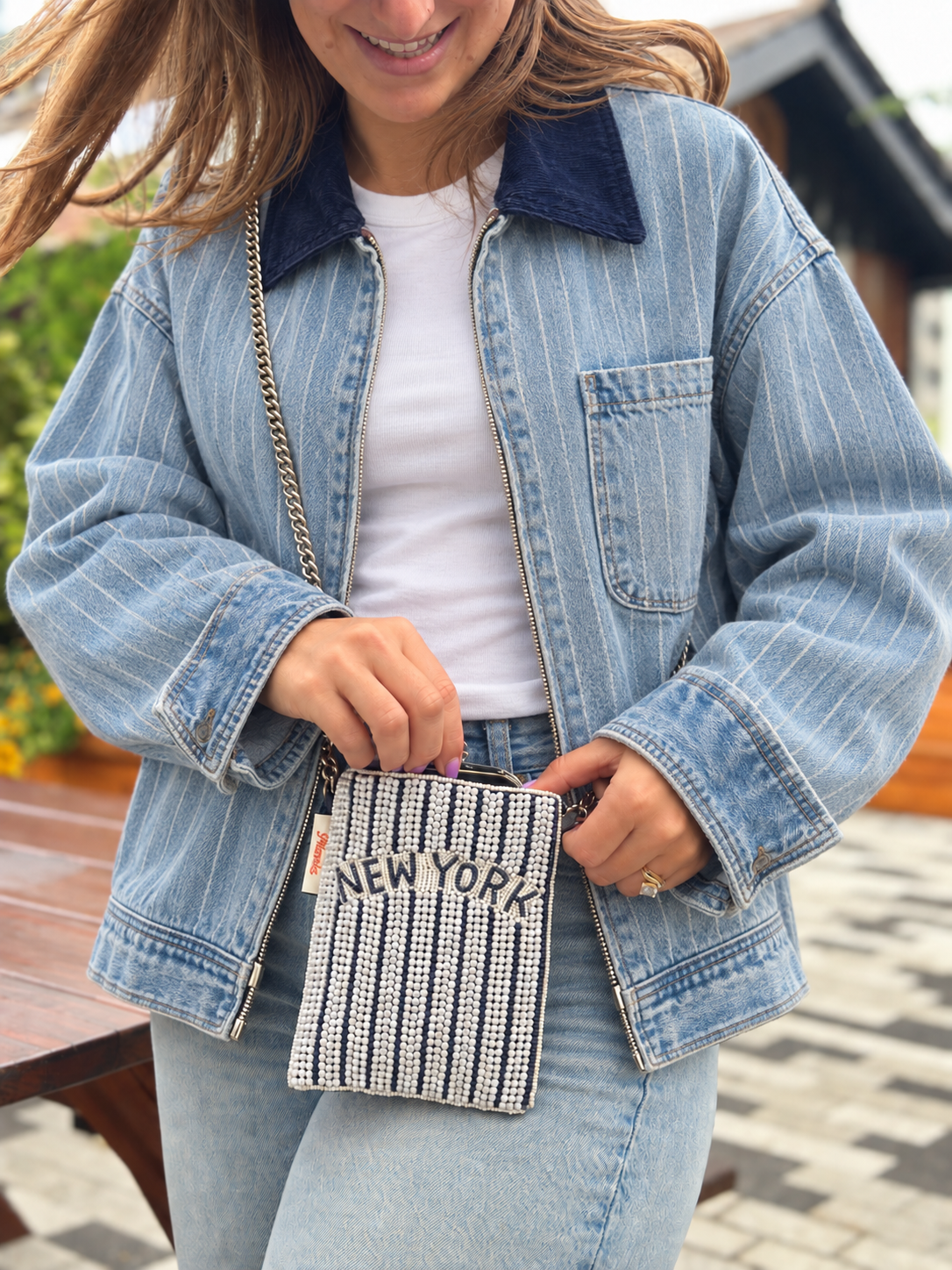 NEW YORK navy and white pinstripe beaded cell phone crossbody styled with light denim jacket