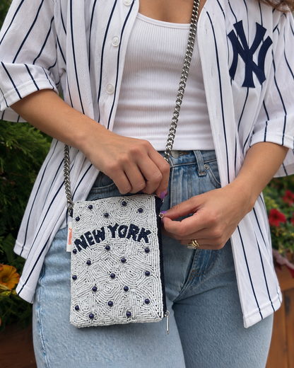 NEW YORK white and navy beaded cell phone crossbody styled with white pinstripe baseball jersey