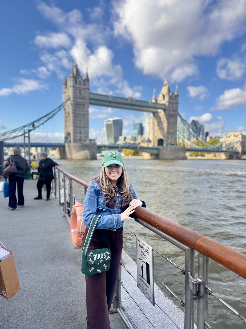 Phannies customer wearing BIRDS beaded bag at Tower Bridge in London