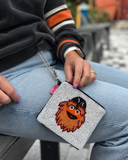 Philadelphia hockey mascot beaded coin purse styled with black and orange sweatshirt